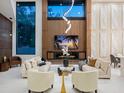 Bright living room with soaring ceilings, fireplace, and modern decor at 1323 Loma Linda Ct, Sarasota, FL 34239