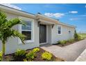 Inviting home with a well-kept landscape with healthy-looking shrubs and stone walkway at 3204 Torta Ct, Bradenton, FL 34211