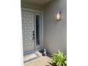 Inviting front entrance with a decorative door, stylish light fixture, and a charming bunny statue at 3407 Avenida Madera # A, Bradenton, FL 34210