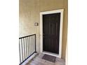 Condo entrance showing the front door with unit number 2024, complemented by a wooden porch at 4037 Crockers Lake Blvd # 24, Sarasota, FL 34238