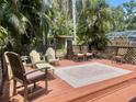 Spacious deck with outdoor seating area, perfect for entertaining and relaxation at 4042 S Lockwood Ridge Rd, Sarasota, FL 34231