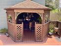 Charming backyard gazebo with seating area, creating a cozy outdoor space at 4042 S Lockwood Ridge Rd, Sarasota, FL 34231