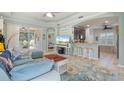 Inviting living room with tile flooring, stylish furniture, and an open floor plan at 5047 Newport News Cir, Bradenton, FL 34211