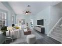 Bright living room features modern furnishings, hardwood flooring, and plenty of natural light at 656 Vallance Ne Way, St Petersburg, FL 33716