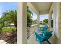 Relaxing front porch with comfortable seating, ideal for enjoying the neighborhood view at 12327 Halfmoon Lake Ter, Bradenton, FL 34211