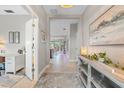 Open hallway with neutral tones, leading to various rooms and offering ample natural light at 12327 Halfmoon Lake Ter, Bradenton, FL 34211