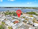 Aerial view shows proximity to water, boat docks, and surrounding neighborhood at 17 Braden Castle Dr, Bradenton, FL 34208