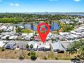 Aerial view of the property highlights location near a pond, other homes and proximity to the city at 17 Braden Castle Dr, Bradenton, FL 34208