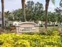 Lighthouse Cove community sign surrounded by beautiful landscaping at 262 Cape Harbour Loop # 101, Bradenton, FL 34212
