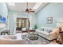 Inviting living room featuring skylights and patio access at 2906 63Rd W St # 206, Bradenton, FL 34209