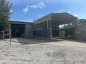 Spacious garage with a car port offers ample parking and storage at 3060 Courtland St, Sarasota, FL 34237