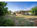 Expansive backyard with lush greenery and ample space for outdoor activities at 3468 Roslyn Rd, Venice, FL 34293