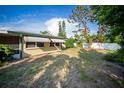 Spacious yard featuring green turf, providing a private outdoor retreat at 3468 Roslyn Rd, Venice, FL 34293