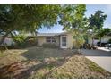 Inviting home with a well-kept lawn and mature trees, offering a serene suburban feel at 3468 Roslyn Rd, Venice, FL 34293