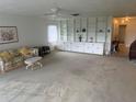 Bright living room with a large built-in bookshelf and storage, perfect for organizing and displaying decor at 3673 Somerville Dr # 1510, Sarasota, FL 34232