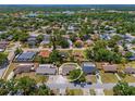 Aerial view of neighborhood showcasing the home's location near lush landscaping and water at 4076 Vana Dr, Sarasota, FL 34241