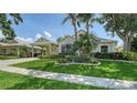 Inviting home exterior with lush greenery, manicured lawn, and architectural details, highlighting the curb appeal at 4612 4Th E Ave, Bradenton, FL 34208