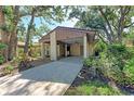 The exterior of the home features a covered parking area, tasteful landscaping and an inviting walkway at 5109 28Th W St, Bradenton, FL 34207