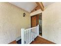 Charming front entrance featuring a wooden door, textured walls, and a ramp at 5109 28Th W St, Bradenton, FL 34207