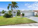 Charming single-story home with a well-maintained lawn and attached two-car garage in a desirable neighborhood at 5110 19Th W Ave, Bradenton, FL 34209