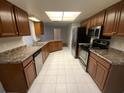 Bright kitchen with stainless steel appliances and abundant cabinet space at 6923 13Th E Ave, Bradenton, FL 34208