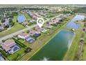 An aerial view of the home showcasing its proximity to the lake and neighborhood amenities at 7508 Ripetta St, Sarasota, FL 34240