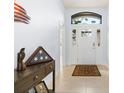 Inviting entryway with a decorative front door, tiled floor, and space for console table at 9229 52Nd E Ave, Palmetto, FL 34221