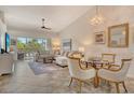 Bright living room with tile flooring, stylish furnishings, and a serene view at 9540 High Gate Dr # 1422, Sarasota, FL 34238