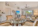 Open living area with tile floors, vaulted ceilings, and sun-filled natural light at 9540 High Gate Dr # 1422, Sarasota, FL 34238