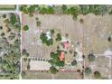 Aerial view of property boundaries showing land, home, barns, and horse arena at 12714 Tyler Run Ave, Odessa, FL 33556