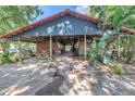 Well-maintained horse stables featuring multiple stalls and ample shade at 12714 Tyler Run Ave, Odessa, FL 33556