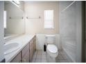 Well-lit bathroom with a single sink vanity, toilet, and shower/tub combo at 16834 Toledo Blade Blvd, Port Charlotte, FL 33954
