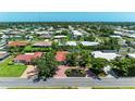 Aerial shot of a charming neighborhood with well-maintained homes and landscaped lawns at 216 Matisse Cir, Nokomis, FL 34275