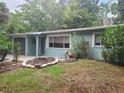 Inviting single-story home featuring muted paint and manicured front yard at 2212 Vinson Ave, Sarasota, FL 34232