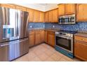 This beautiful kitchen has stainless steel appliances, beautiful countertops, and plenty of cabinet storage at 3409 10Th W Ln, Palmetto, FL 34221