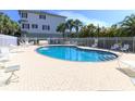 Enjoy the community pool and lounge area surrounded by lush landscaping and a secure fence at 3409 10Th W Ln, Palmetto, FL 34221
