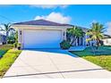 Inviting home features a two-car garage, updated lighting, and a well maintained, extended driveway at 3835 W Price Blvd, North Port, FL 34286