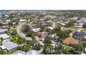 Wide aerial view of the home in a lush neighborhood at 417 Park Lane Dr, Venice, FL 34285