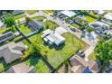 Beautiful aerial view of the property showcasing its landscaping, surrounding neighborhood and nearby streets at 4519 Brooksdale Dr, Sarasota, FL 34232