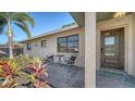 Close-up of the front entrance with a small patio area, perfect for enjoying the outdoors at 4611 Spahn St, Sarasota, FL 34232