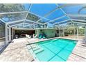 Relaxing screened-in pool area with a sparkling pool and comfortable lounge seating at 4907 18Th W Ave, Bradenton, FL 34209