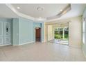Bright living room with tile floors, sliding glass doors, and recessed lighting at 5418 Fairfield Blvd, Bradenton, FL 34203