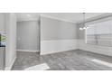 Bright dining area showcasing tile floors, wainscoting and a charming chandelier at 6125 Anise Dr, Sarasota, FL 34238