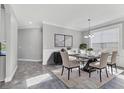 Elegant dining room featuring a modern table, stylish chairs, and a chic chandelier at 6125 Anise Dr, Sarasota, FL 34238