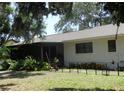 Back of house showing screened porch and fenced area at 2475 Wood Oak Dr, Sarasota, FL 34232
