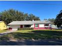 Inviting one-story home with a well-kept lawn and mature trees in a peaceful neighborhood at 2833 62Nd N St, St Petersburg, FL 33710