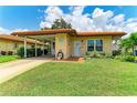 Inviting single-story home featuring a lush green lawn and terracotta tiled roof at 3213 Mercer Rd, Bradenton, FL 34207