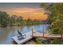 Relaxing view from the home's private dock, highlighting waterfront tranquility and mature landscape at 3500 Liberty St, Port Charlotte, FL 33948