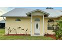 Inviting front entrance featuring a decorative glass door and well-maintained landscaping at 4353 Hidden River Rd, Sarasota, FL 34240