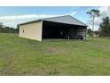 Spacious metal outbuilding perfect for storage or workshop on a large lot at 4353 Hidden River Rd, Sarasota, FL 34240